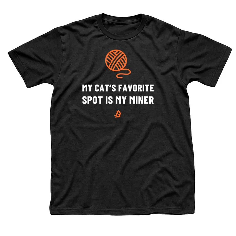 Black t-shirt with an orange ball of yarn above My Cat’s Favorite Spot Is My Miner in white capitals and a small orange Bitcoin symbol below