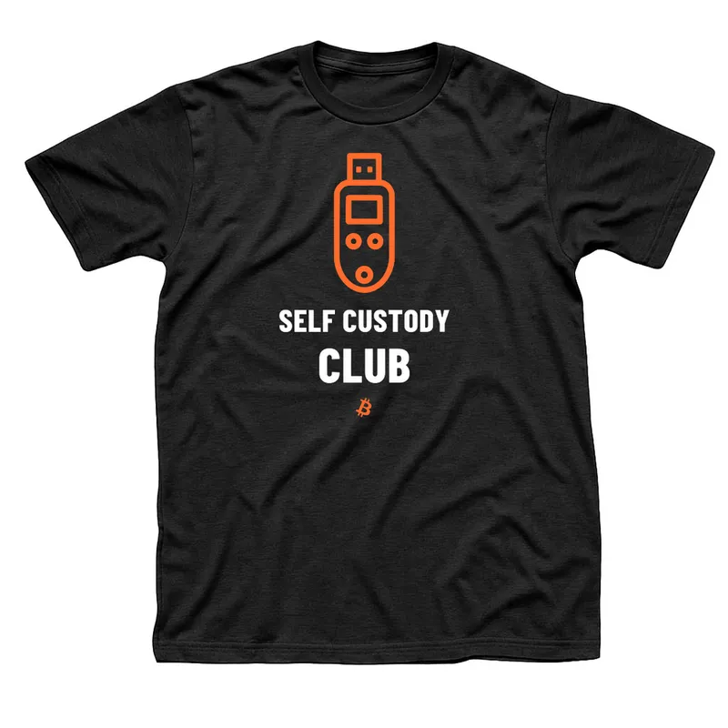 Black t-shirt with an orange hardware key device above Self Custody Club in white, with a small orange Bitcoin symbol below