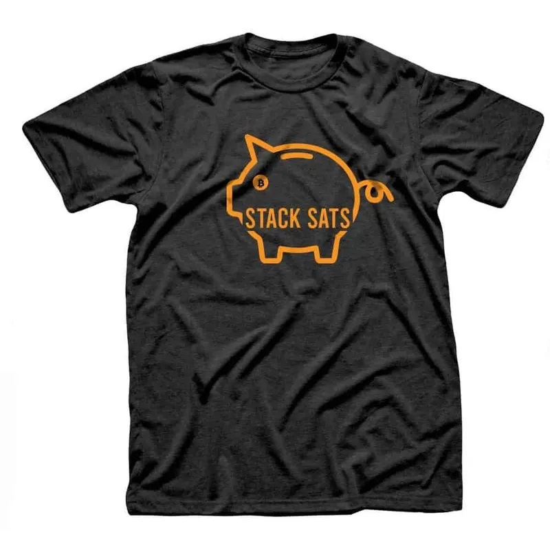 Black t-shirt with an orange outline piggy bank and the words Stack Sats
