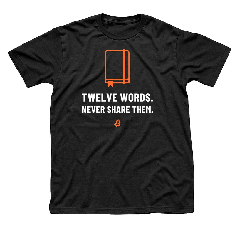 Black t-shirt with an orange closed notebook above Twelve Words, Never Share Them in white capitals and a small orange Bitcoin symbol below