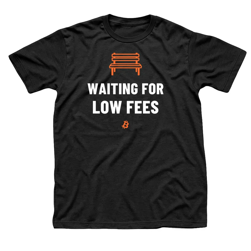 Black t-shirt with an orange park bench above Waiting for Low Fees in white capitals and a small orange Bitcoin symbol below
